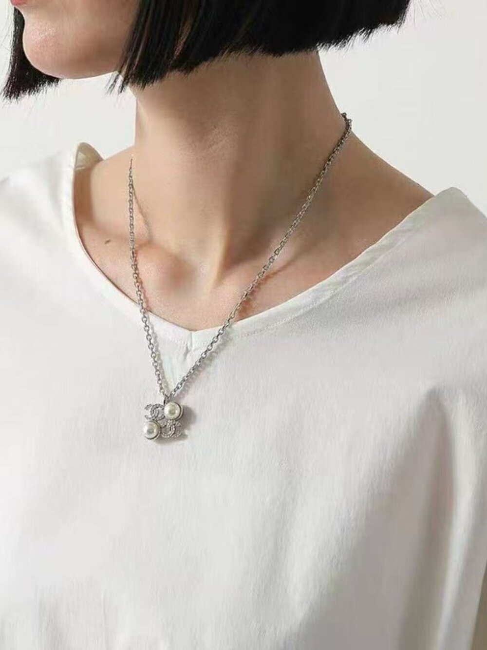 Chanel classic double C diamond and pearl pendant necklace